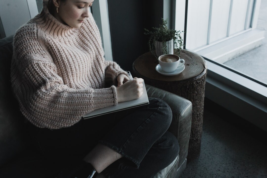 woman writing in journal