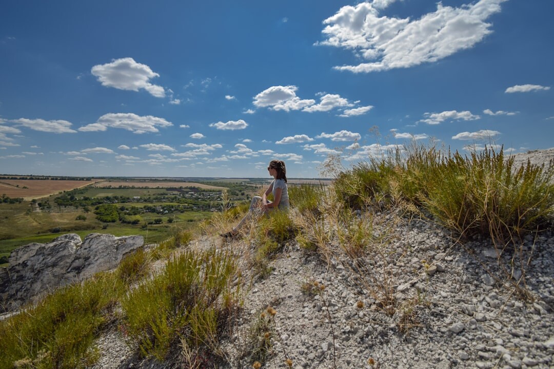 person meditating in nature